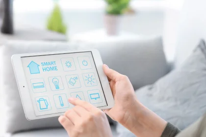 Hands holding tablet with smart home controls