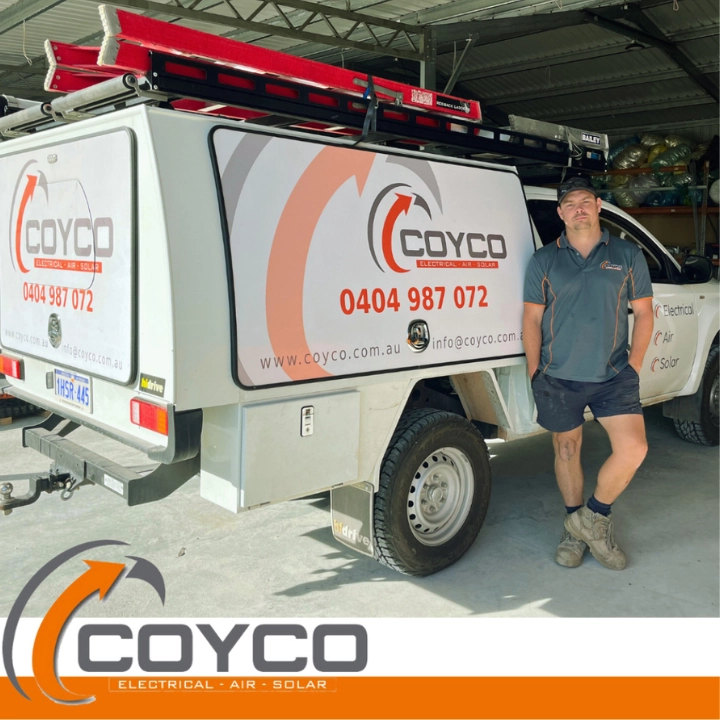 Owner of COYCO Mick standing beside his Truck with the COYCO signage